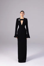 Load image into Gallery viewer, Black evening gown with a unique design on a gray background